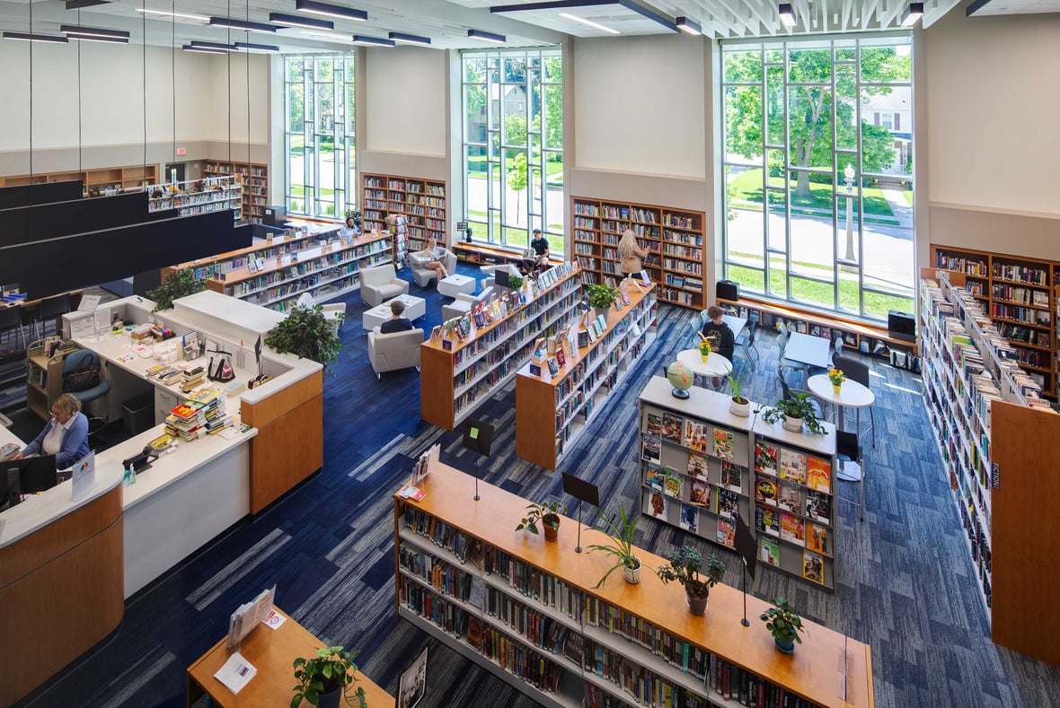 View from the balcony of the newly completed Kohler School District library, showcasing students and community members engaged in reading and studying in a modern, inviting space.