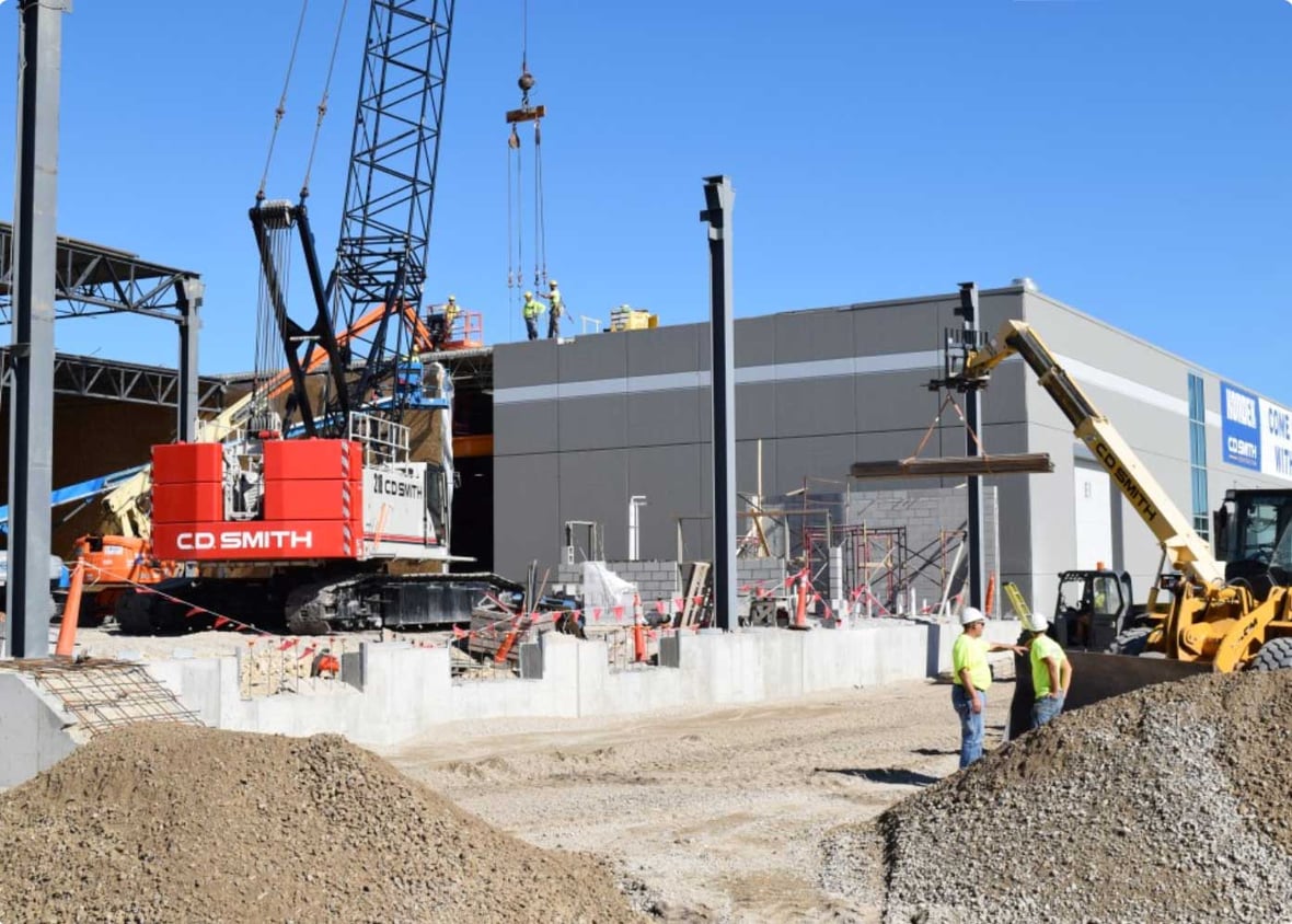C.D. Smith Construction crane placing concrete precast panels for building Kondex Corporation's 60,000 square-foot manufacturing and warehouse addition