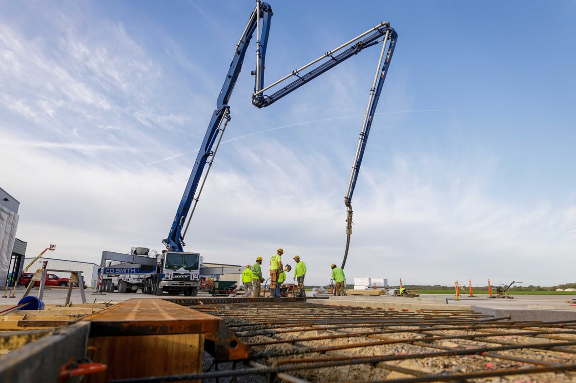 CD Smith Construction Concrete Workers at Project jobsite with rebar in foreground