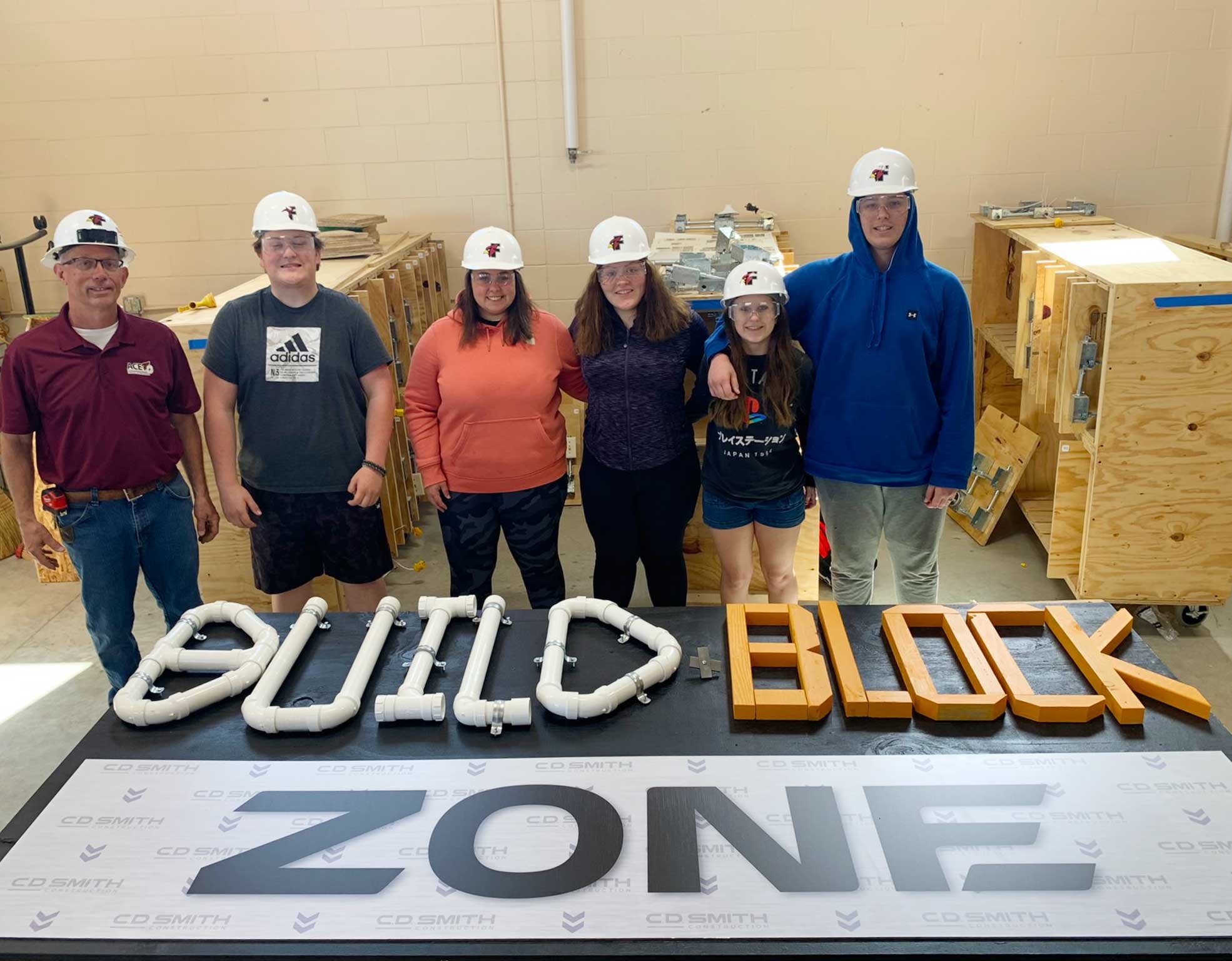 Fond du Lac High School ACE Academy students Build & Block Zone with C.D. Smith Construction for Walleye Weekend