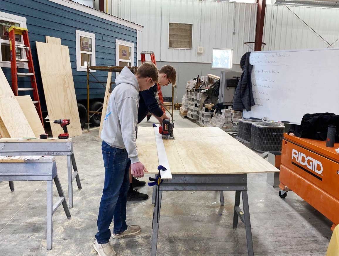 Students working on a tiny house in an advanced construction class in Wisconsin