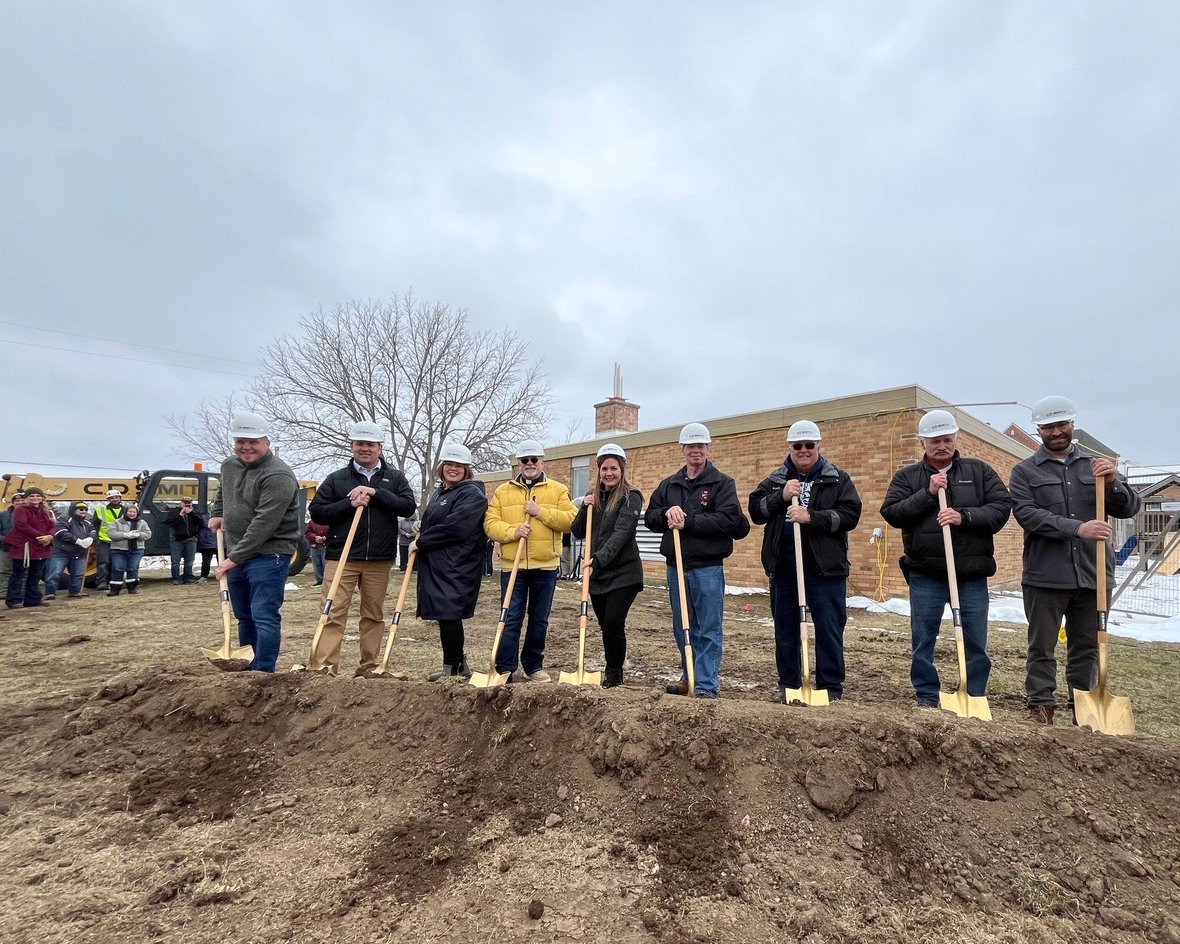 Board group with shovels of dirt at St. Matthew School daycare project groundbreaking with CD Smith Construction