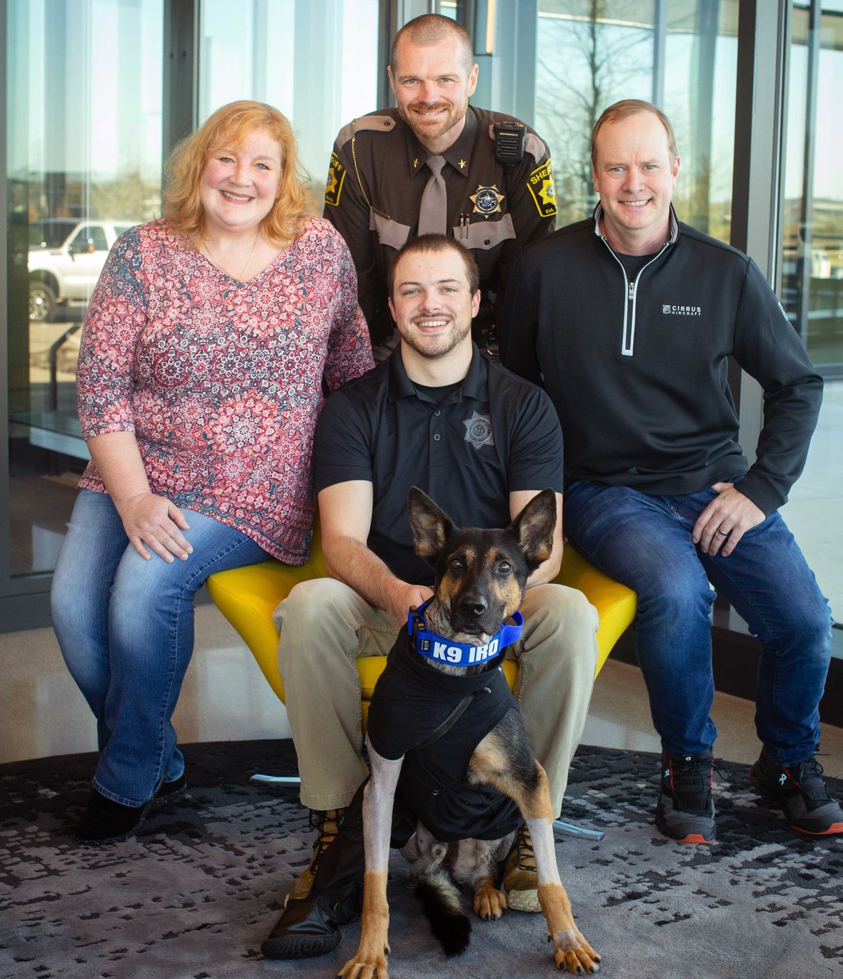 Artist Mindy Leitner Deputy Evans K9 Iro Justin Smieth and Sheriff Waldschmidt at CD Smith Construction Fond du Lac Wisconsin Office