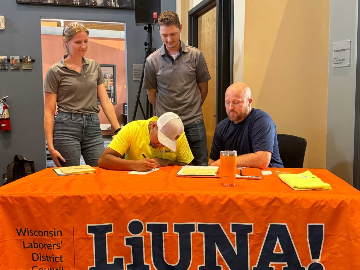Bryan signing with C.D. Smith Construction and Local Union 464 as Wisconsin laborer