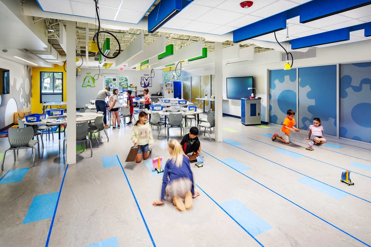 Elementary students in hands-on learning activities STEAM classroom at Kohler School District, built by CD Smith Construction