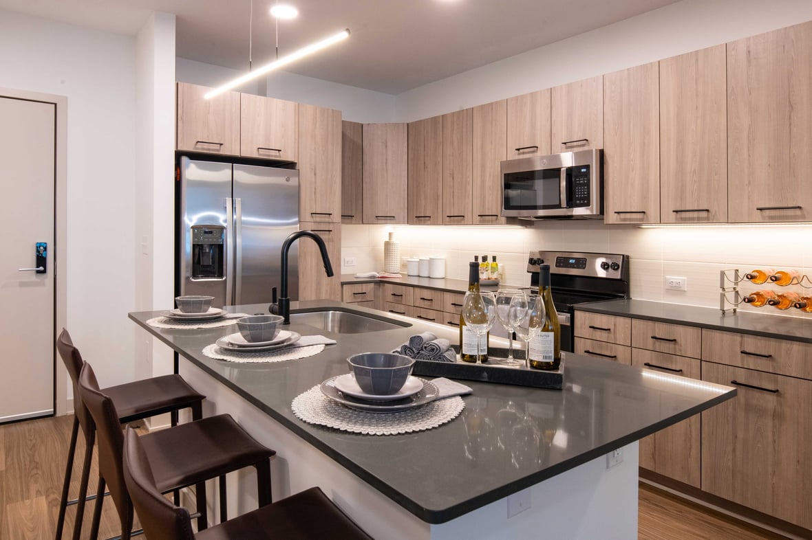 Modern kitchen interior luxury unit at Brickline at The Mercantile apartment building in Omaha Nebraska with CD Smith Construction Manager