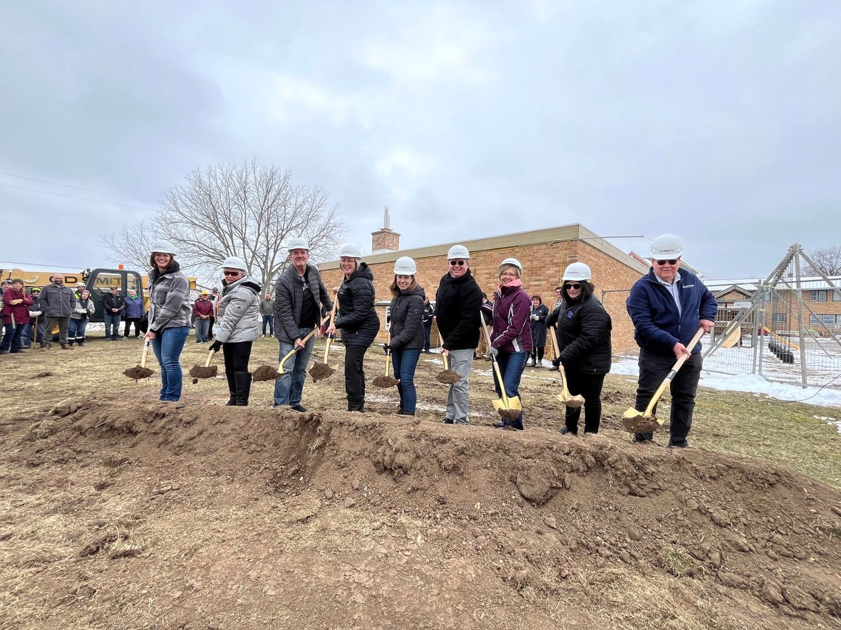 CD Smith and project team with shovels of dirt at St. Matthew School daycare project groundbreaking in Campbellsport Wisconsin