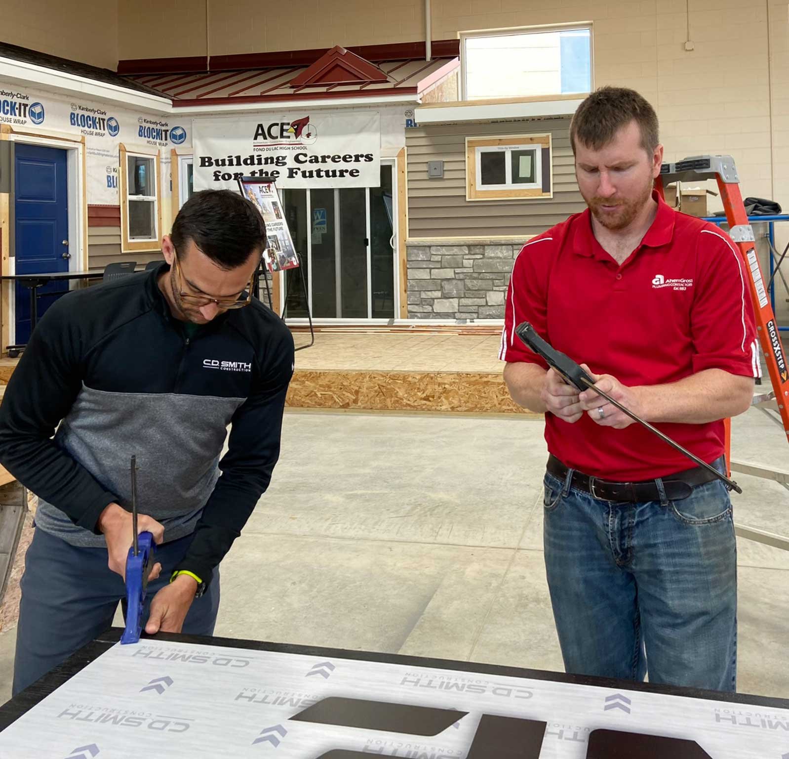 Fond du Lac High School ACE Academy students Build & Block Zone with C.D. Smith Construction for Walleye Weekend