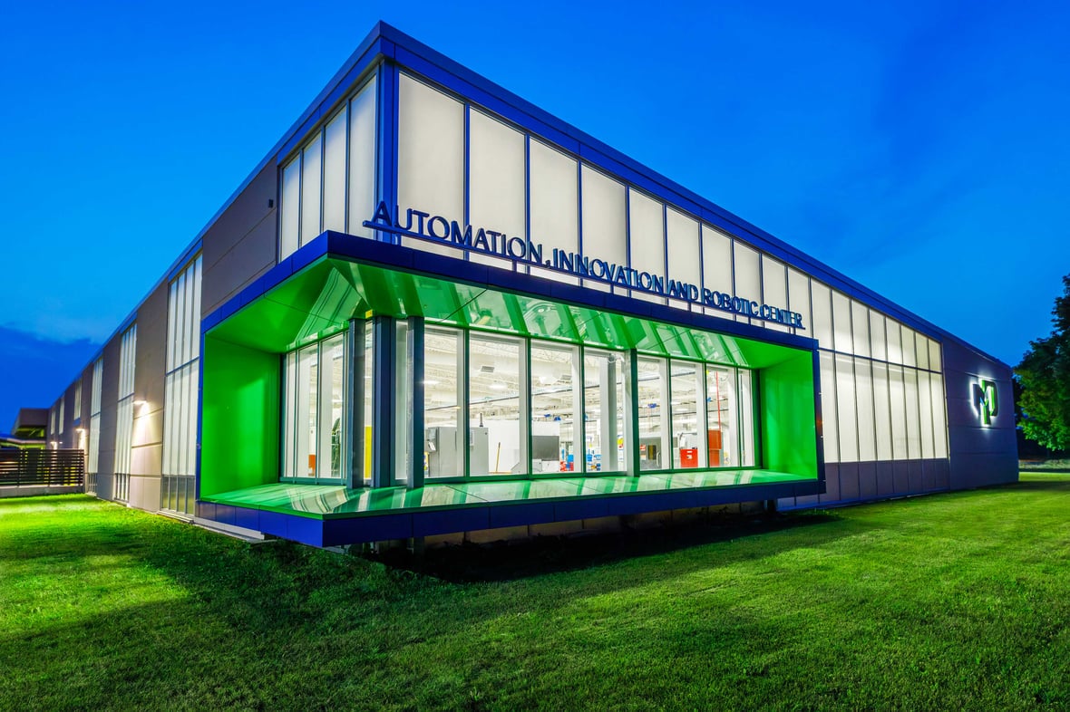Exterior view of the newly built Moraine Park Technical College AIR Center illuminated at dusk in Fond du Lac, Wisconsin.