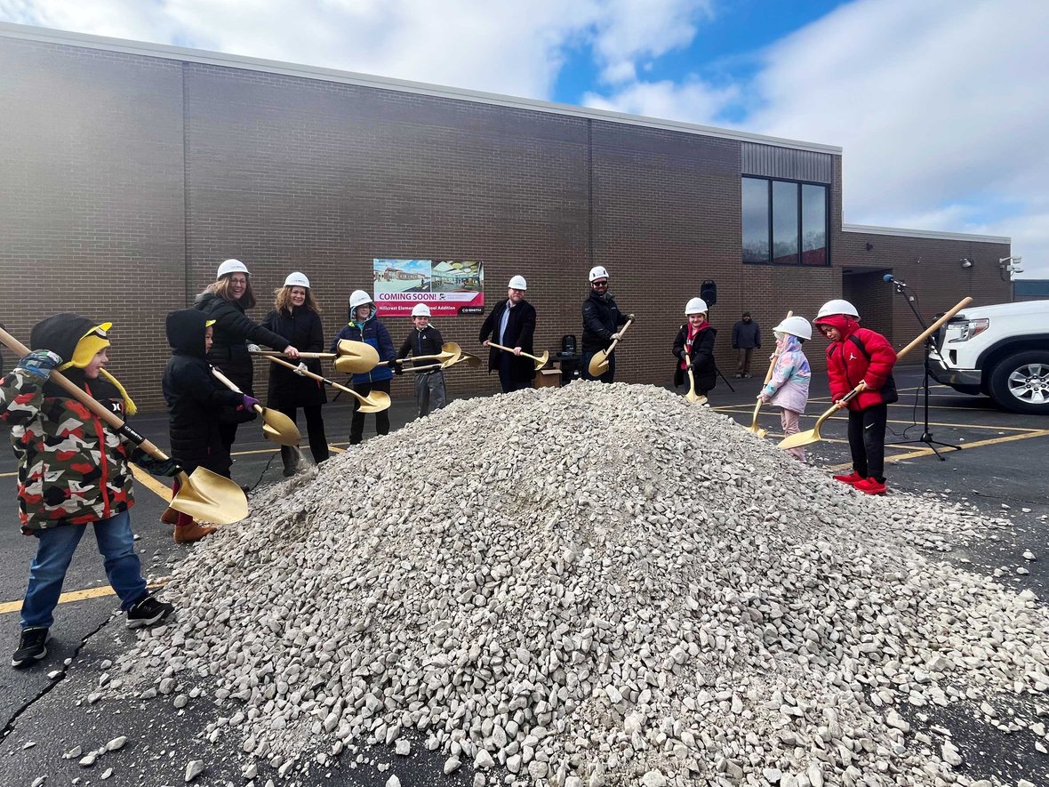 Superintendent students and project team with shovels and CD Smith Construction hard hats at Pulaski Hillcrest Elementary School Project Groundbreaking
