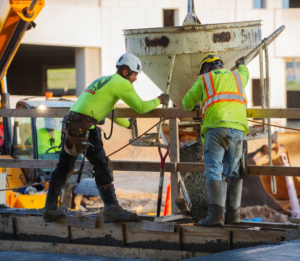 Wide-angle view of active construction at the future Milwaukee County medical examiner and emergency management facility — a major healthcare infrastructure project in Wisconsin.