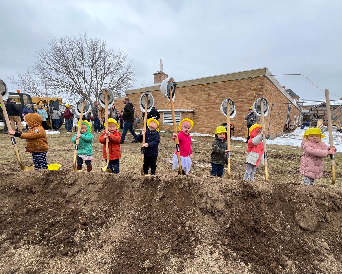 Daycare children with shovels of dirt at St. Matthew School daycare project groundbreaking with CD Smith Construction