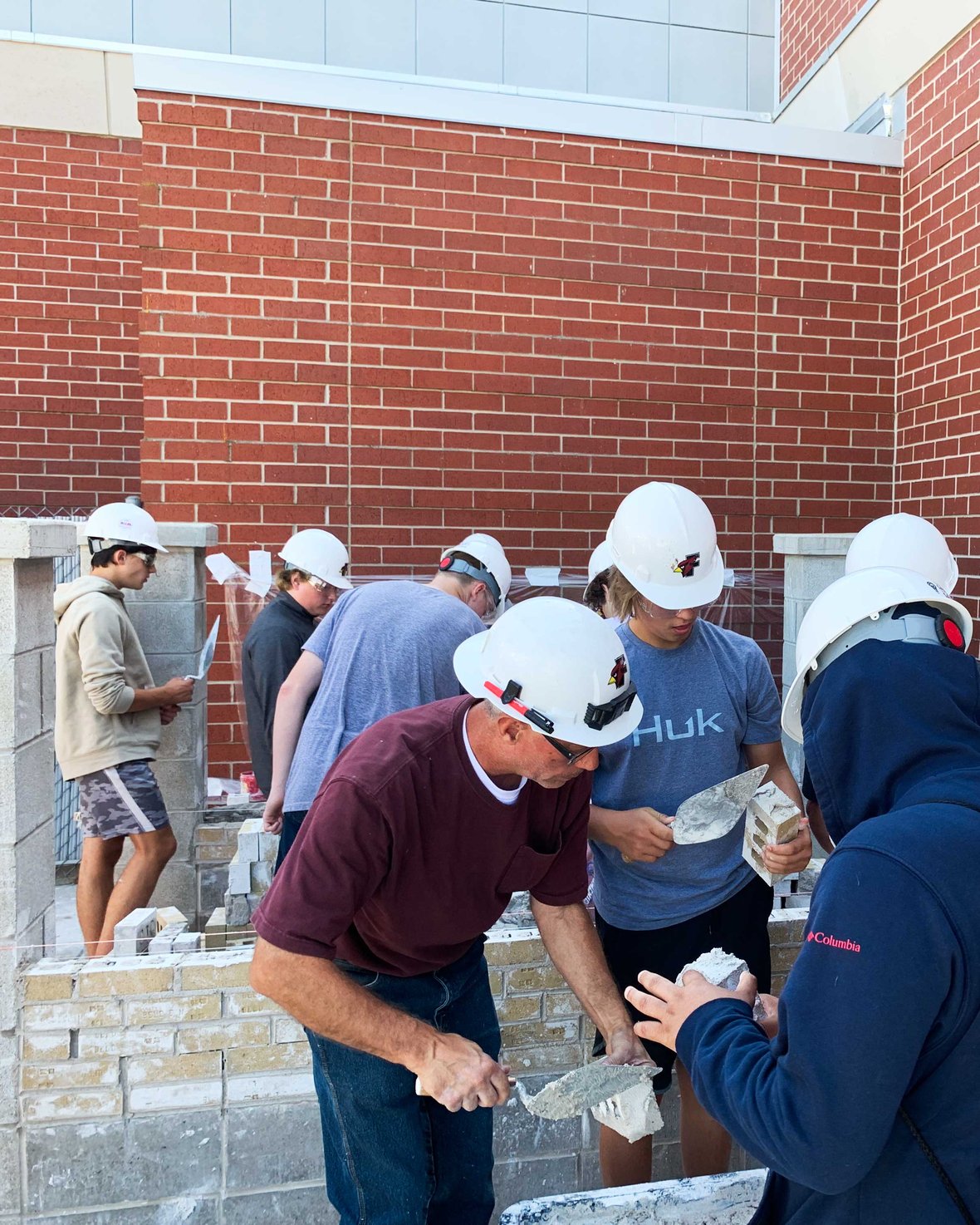 Fond du Lac Architecture Construction Engineering students working in a masonry construction practice are laying bricks