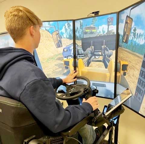 Students running heavy equipment simulator at an operating engineers training facility in Wisconsin