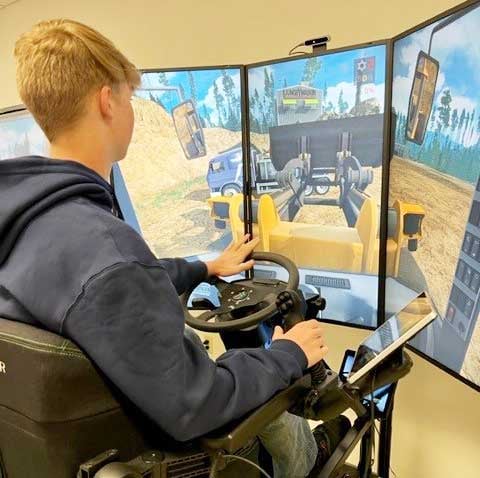 Students running heavy equipment simulator at an operating engineers training facility in Wisconsin 