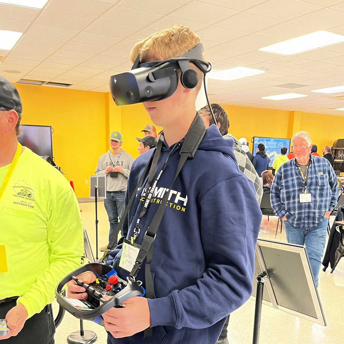 Students running heavy equipment in virtual reality at an operating engineers training facility in Wisconsin