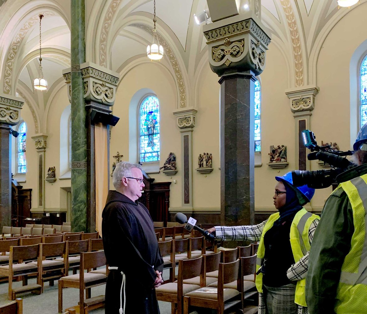 Provincial Minister brother Mark Joseph Costello being interviewed about St. Francis' Historic Renovation Construction