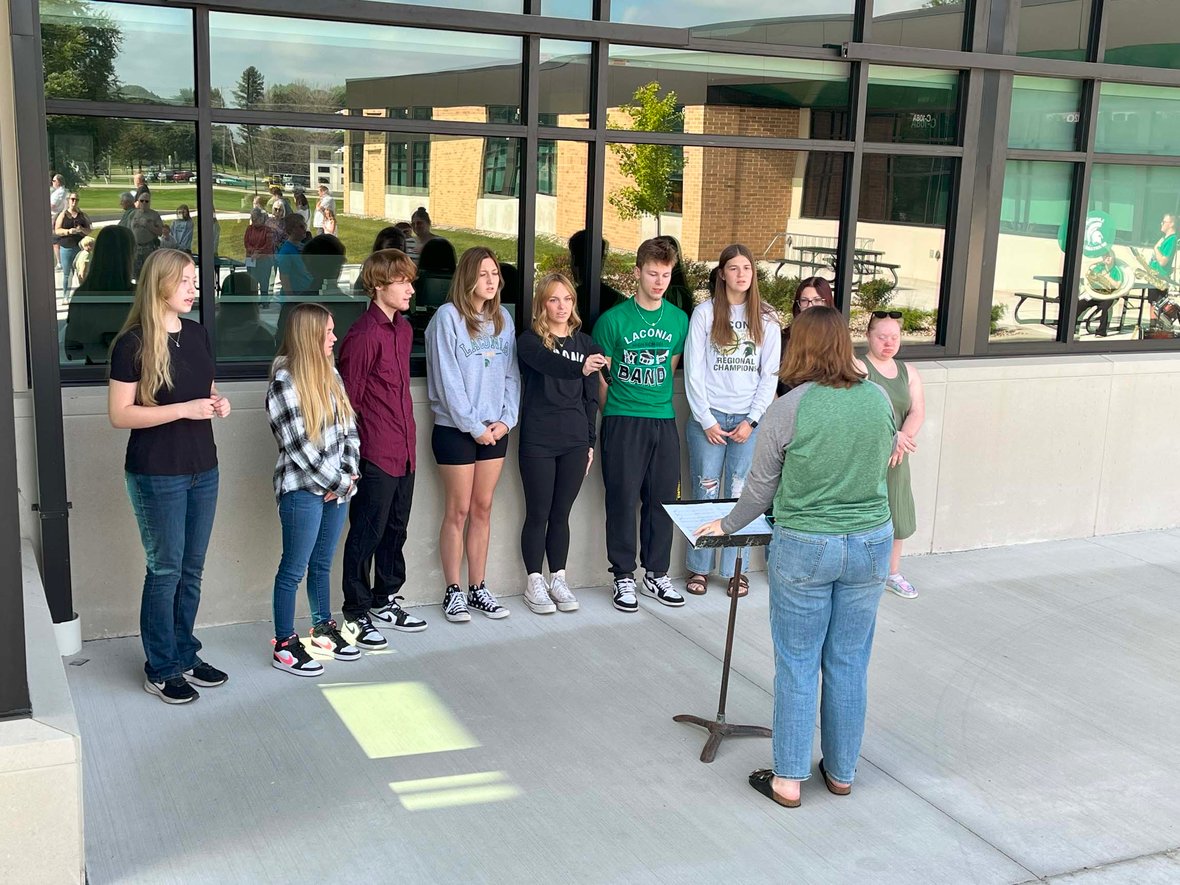 Laconia students sing under the direction of their teacher during the ribbon cutting celebration for the Rosendale-Brandon referendum project.
