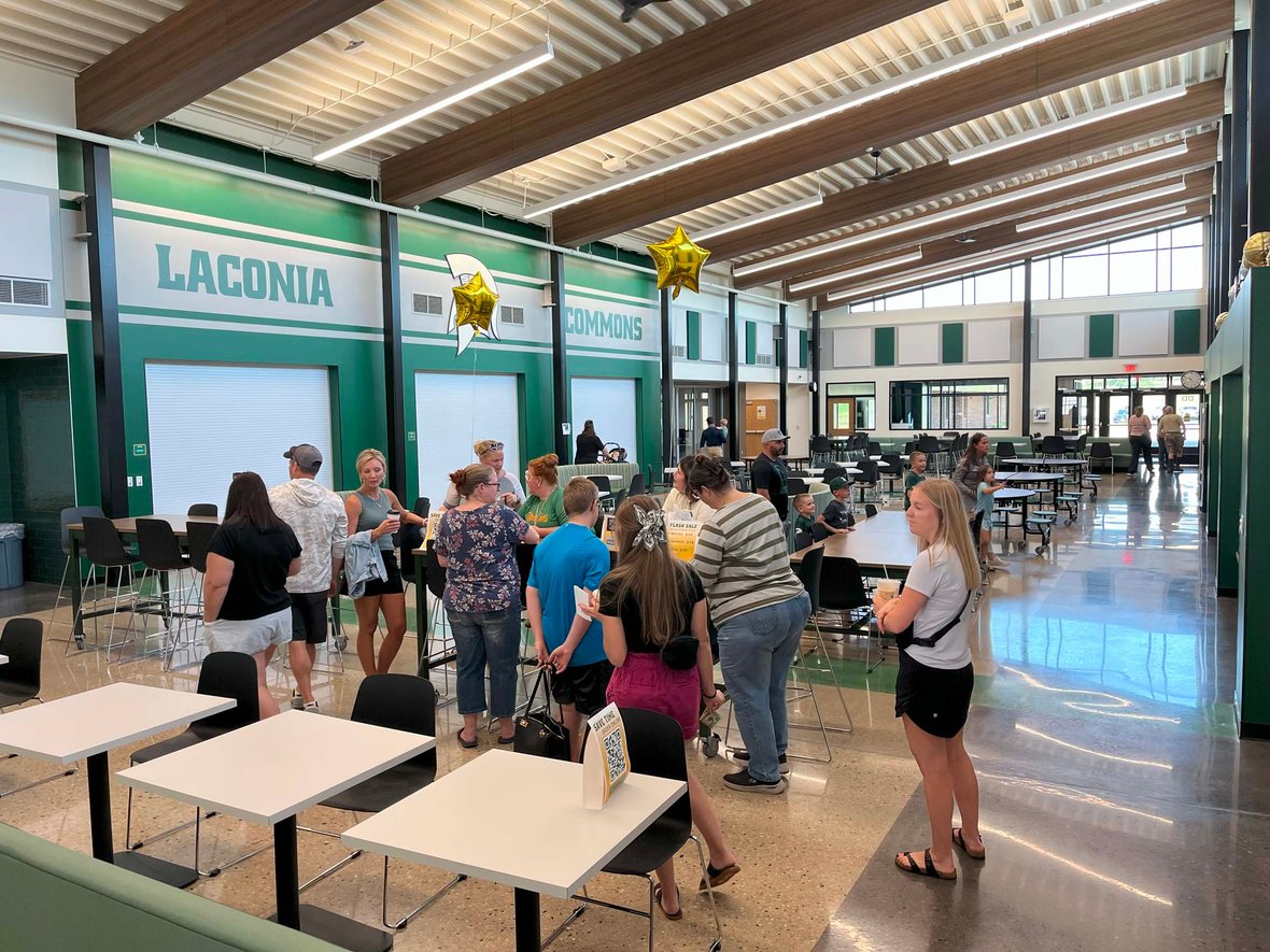 Families and students gather inside the renovated Laconia Commons to see the new cafeteria and seating areas during the Rosendale-Brandon ribbon cutting.