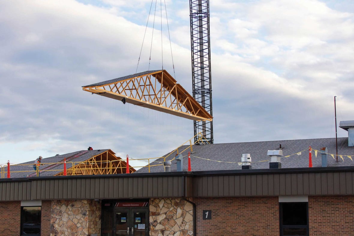 Roof truss being lifted into place during Sunnyside Elementary School renovation