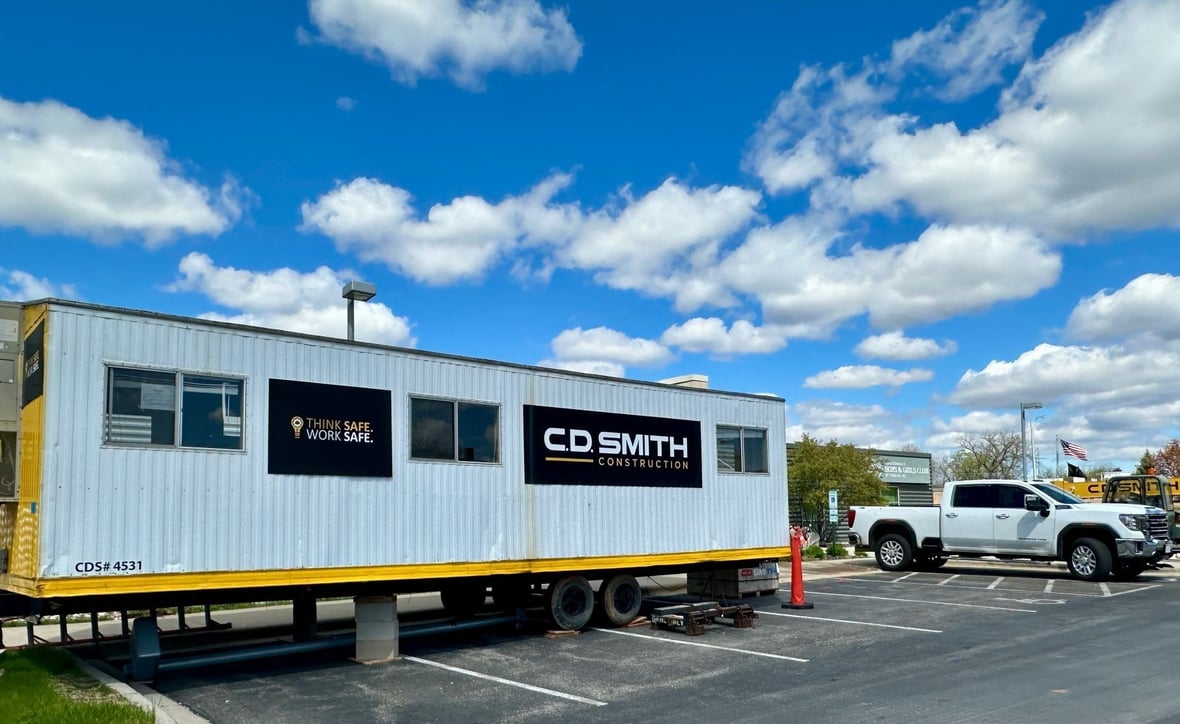Temporary construction trailer and active project site at the Boys &amp; Girls Club of Fond du Lac expansion project.