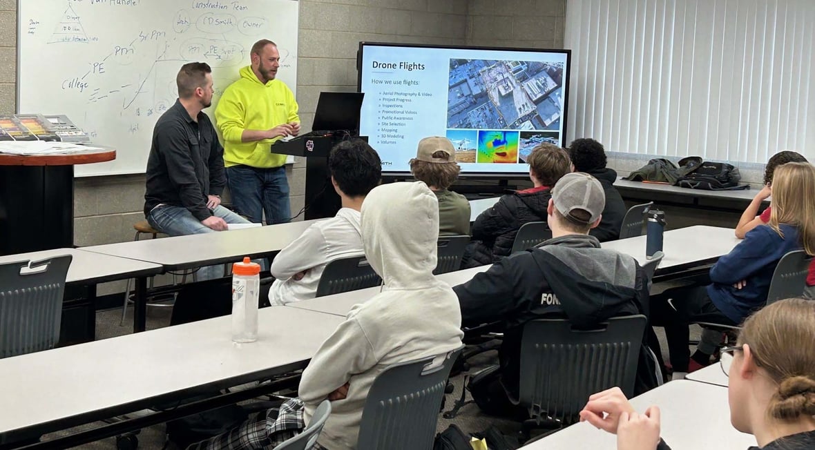 C.D. Smith construction professionals presenting drone flight and VDC technology applications to Franklin High School students during a CDS School Partnership Program classroom session.