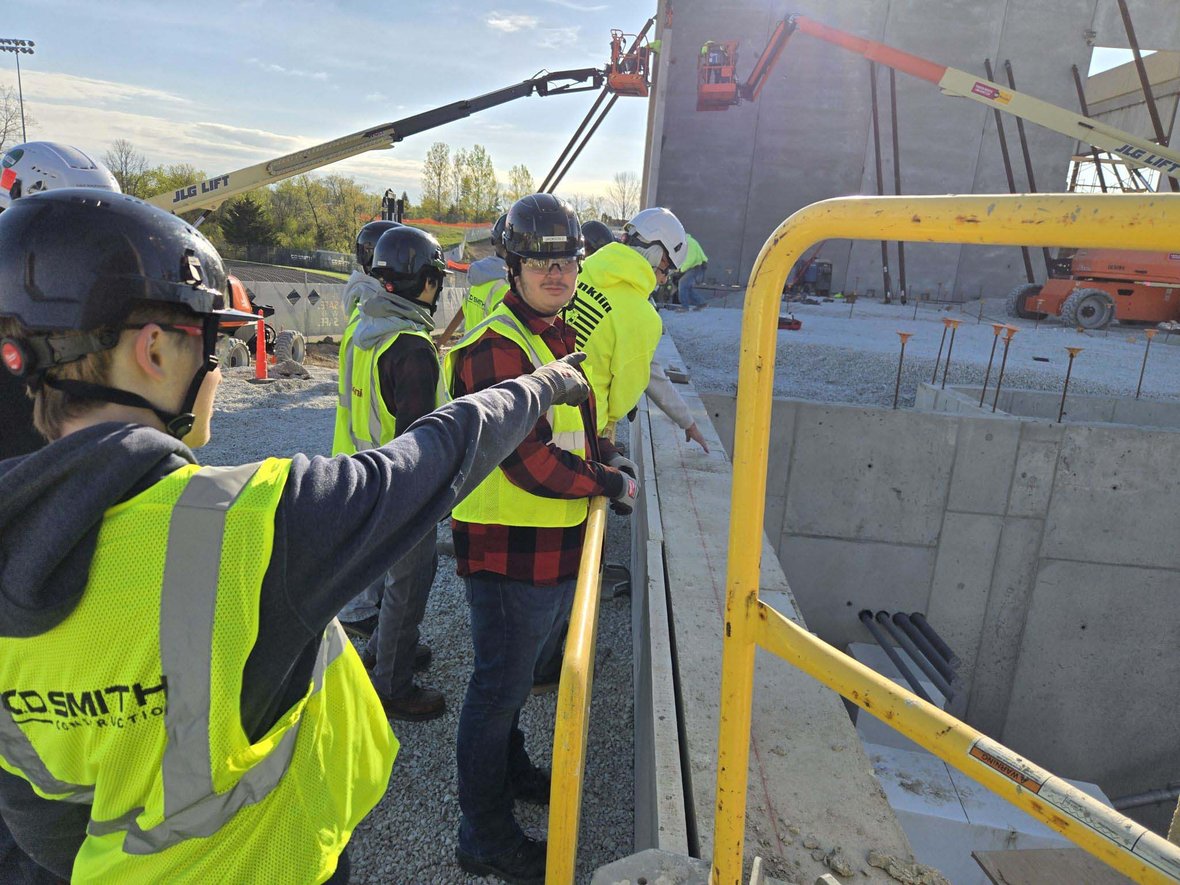 Franklin High School students in C.D. Smith safety vests getting an up-close look at foundation and wall construction during a CDS School Partnership Program jobsite tour.