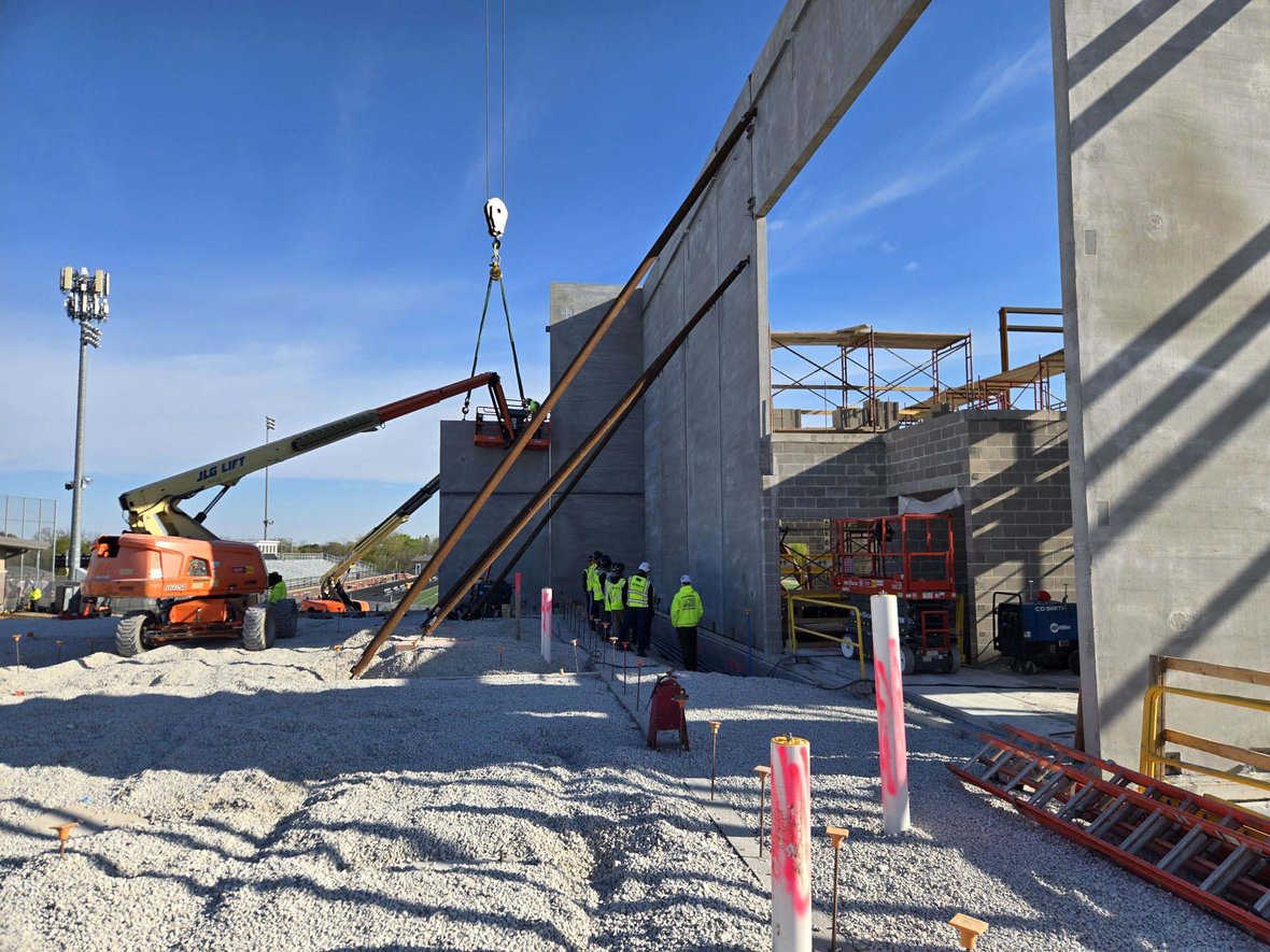 Franklin High School students observing crane and wall panel installation operations at an active C.D. Smith construction project as part of the CDS School Partnership Program.