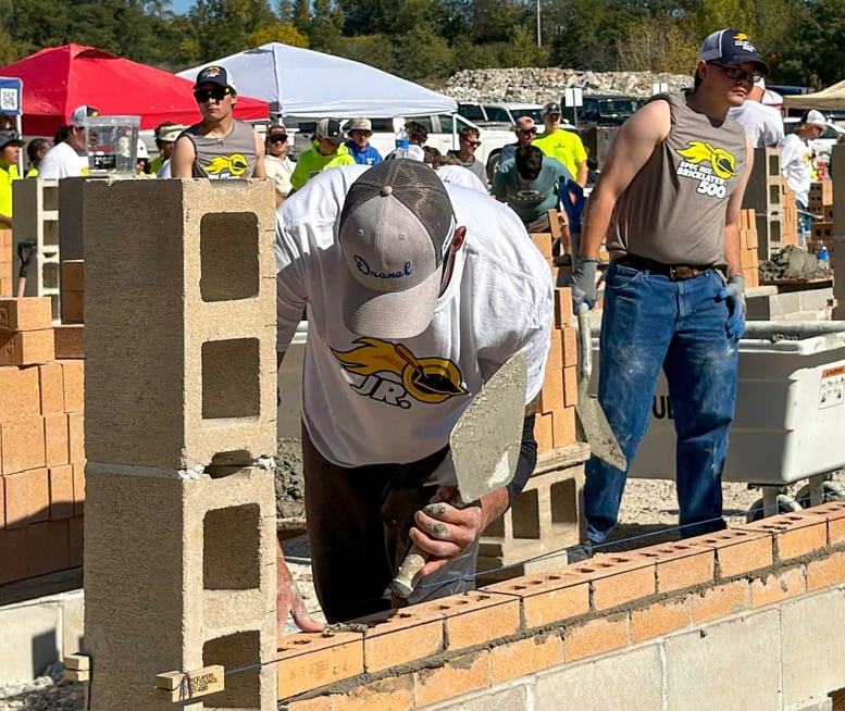 Participant laying brick during the 2026 JR. SPEC MIX Bricklayer 500 in Fond du Lac, Wisconsin.