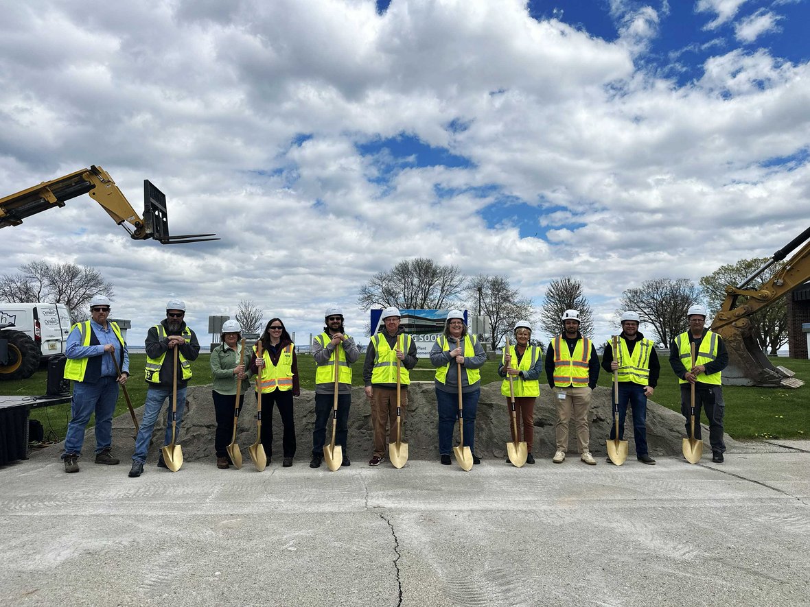 Groundbreaking Ceremony with stakeholders holding shovels in front of staged pile of dirt for City of Oshkosh Water Filtration Plant construction by C.D. Smith
