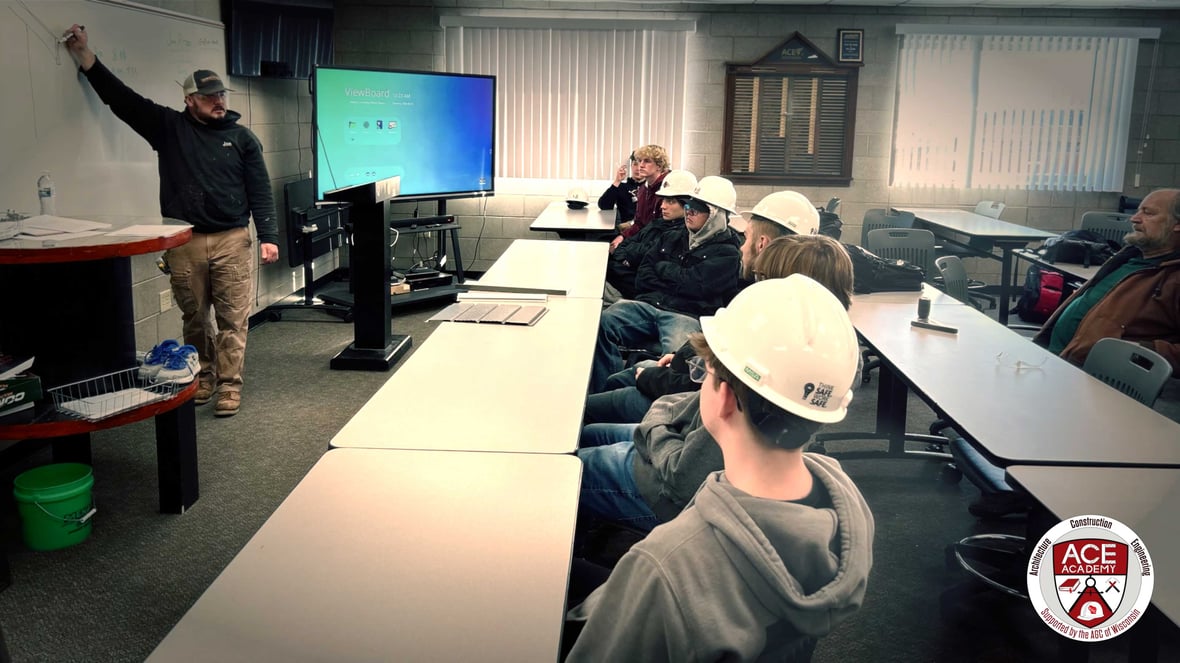 Students collaborating on a real-world construction project at ACE Academy, gaining career-ready skills in skilled trades education classroom learning.