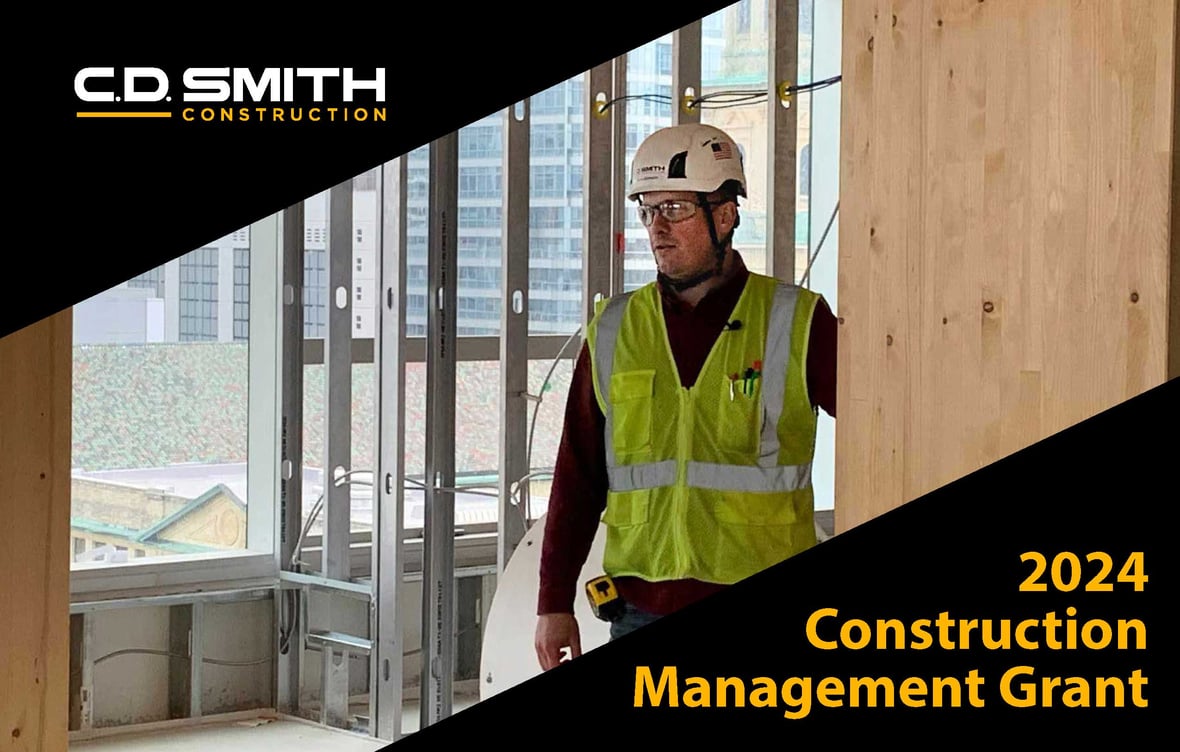 CD Smith Construction Project Manager at Mass Timber jobsite by wood column with headline for 2024 construction management grant