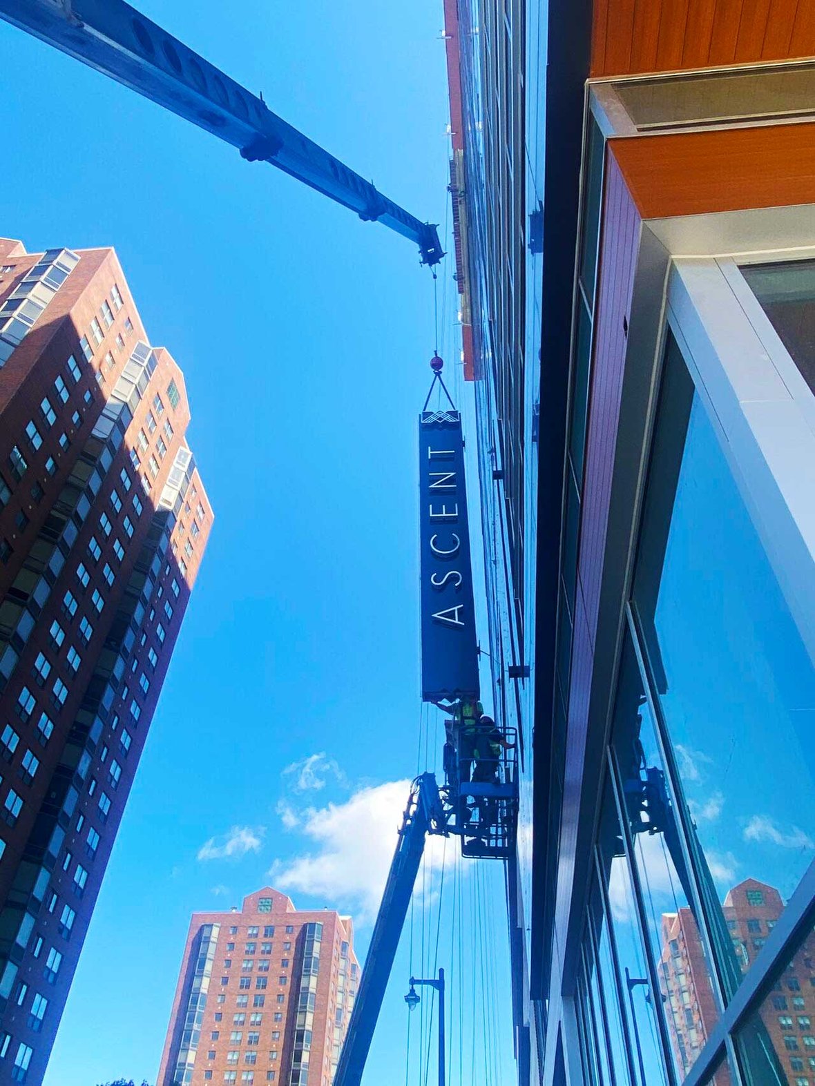 Signage going up for Ascent luxury apartment mass timber high-rise in Milwaukee, Wisconsin