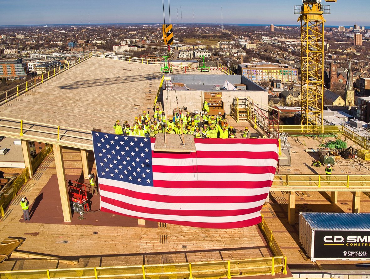 Ascent mass timber construction project in Milwaukee Wisconsin Topping Off with Flag