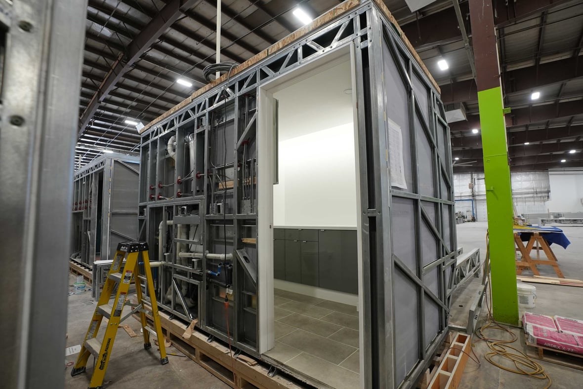 Volumetric pod prefabrication for commercial construction in Wisconsin: Fully finished prefabricated bathroom pod built off-site by C.D. Smith, ready for installation to ensure consistency, quality, and cost savings on large-scale projects.