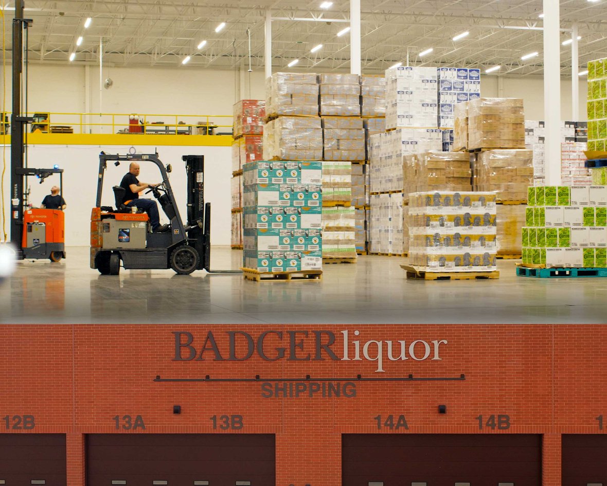 Badger Liquor Warehouse Addition Interior with Forklift Operator and Exterior Built by CD Smith Construction