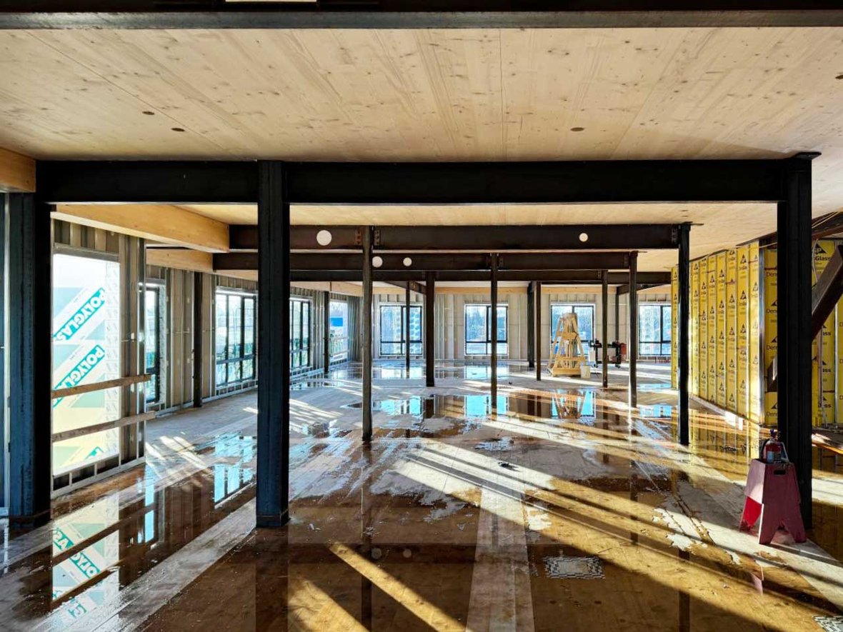 Bakers Place Mass Timber Construction Project interior photo showing wood and steel beams and floor systems with CD Smith as GC in Madison Wisconsin
