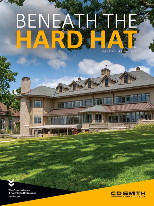 Cover of Beneath the Hard Hat Magazine Issue 8 Spring 2025 by C.D. Smith Construction, showing The Commodore – A Bartolotta Restaurant on Nagawicka Lake, Delafield, WI. Highlights Wisconsin commercial construction and historic renovation.