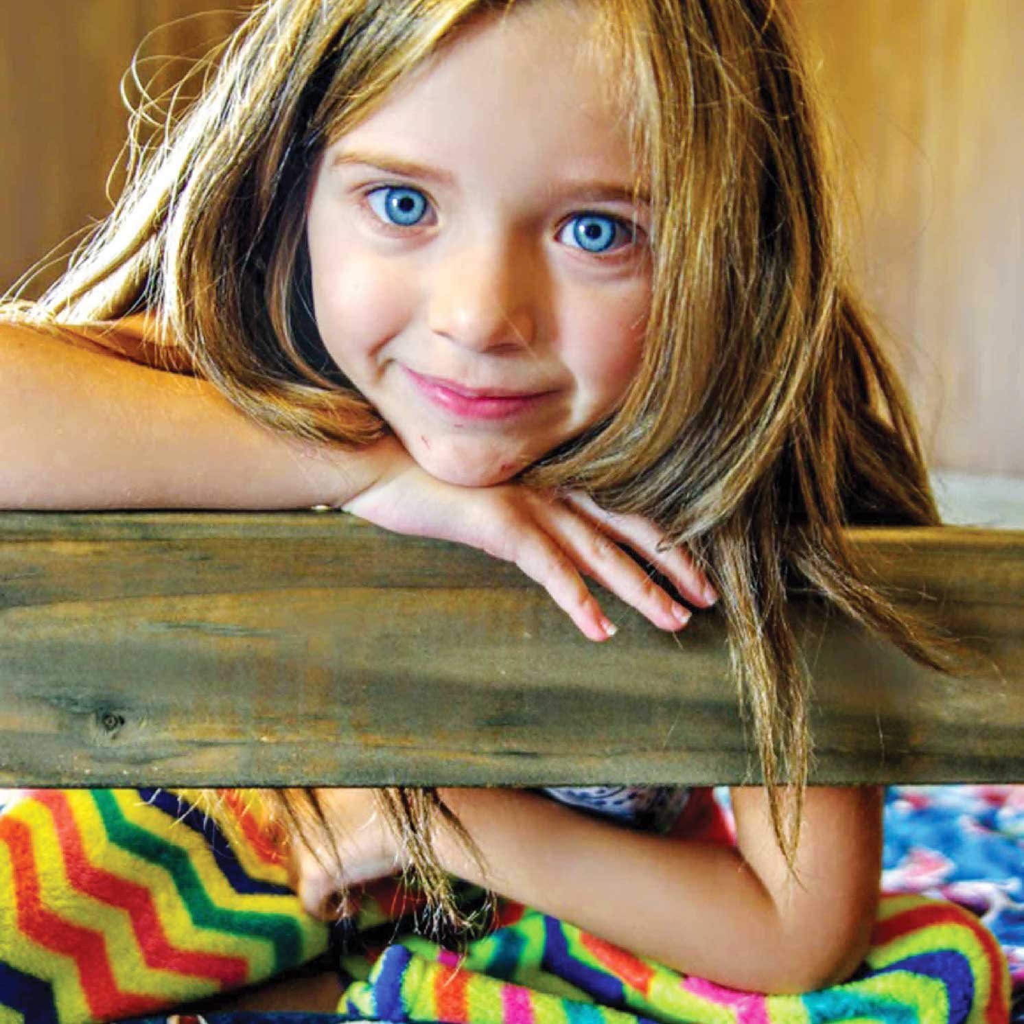 Girl in bunk bed from Sleep in Heavenly Peace (SHP), a non-profit org that C.D. Smith Construction supports
