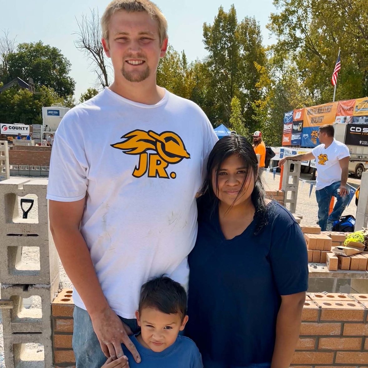 CD Smith Construction masonry apprentice Tom Qualy with his wife and son at Fond du Lac Wisconsin Bricklayer competition