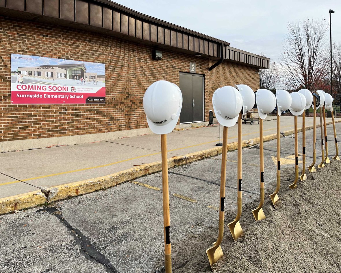 CD Smith Construction hard hats on shovels at Pulaski School District Sunnyside Project Groundbreaking