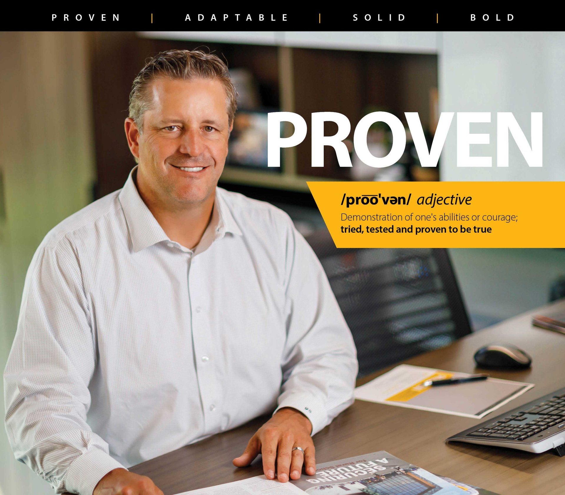 CD Smith Construction Senior Vice President Greg Sabel at his desk with PROVEN overlay and definition