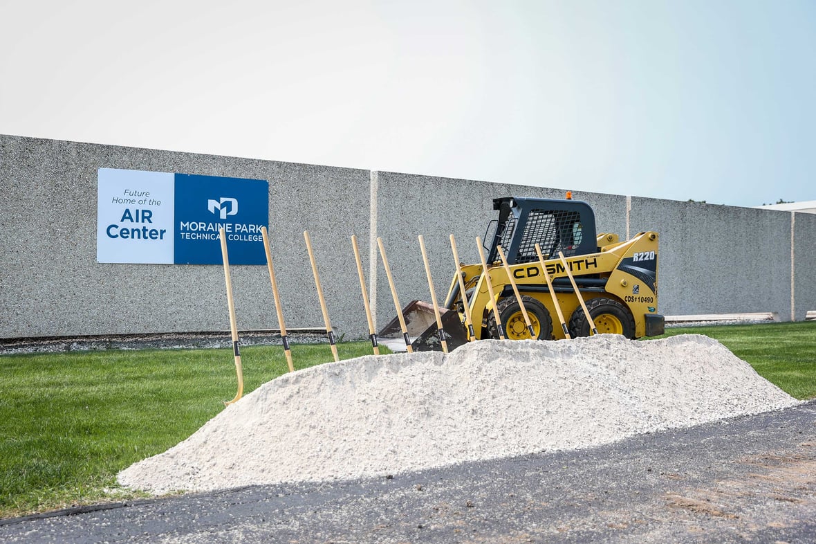 C.D. Smith Construction equipment with shovels at groundbreaking at Moraine Park Technical College