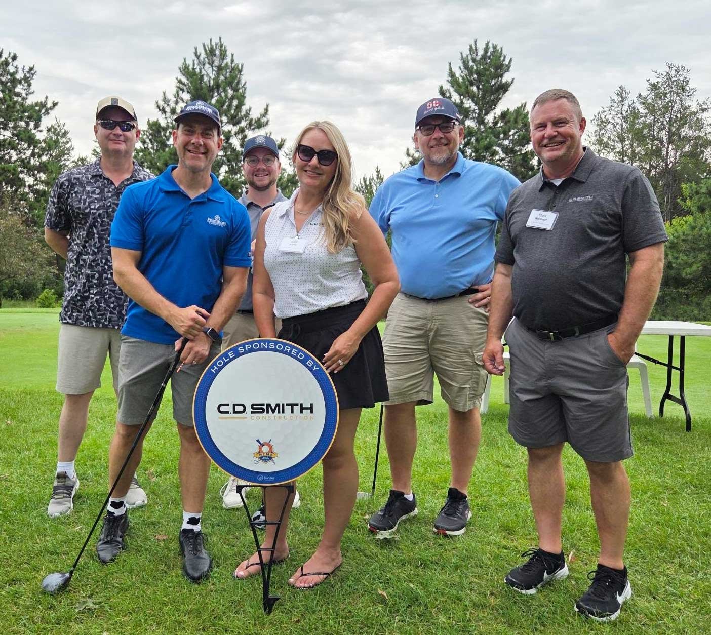 CD Smith Construction hosted hole at WCMA Golf Outing hosted by April and Chris with golf group