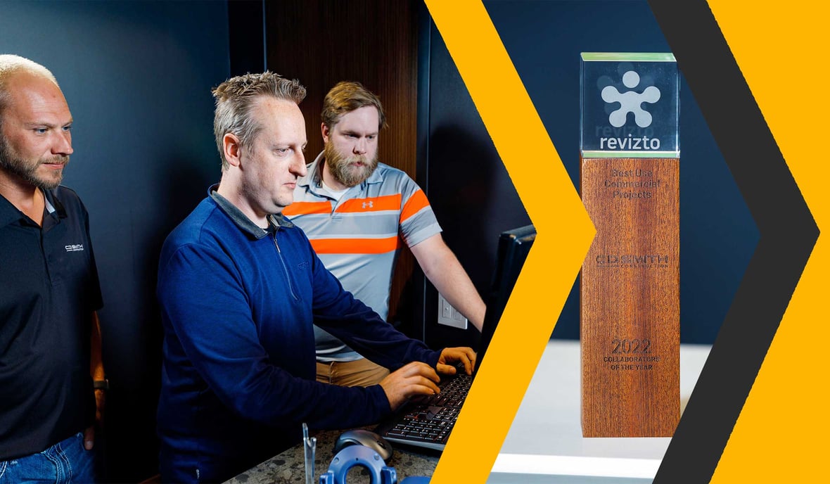 CD Smith Virtual Design + Construction team at desktop monitor navigating virtual project site in collaboration on project in Wisconsin winning Revizto Award