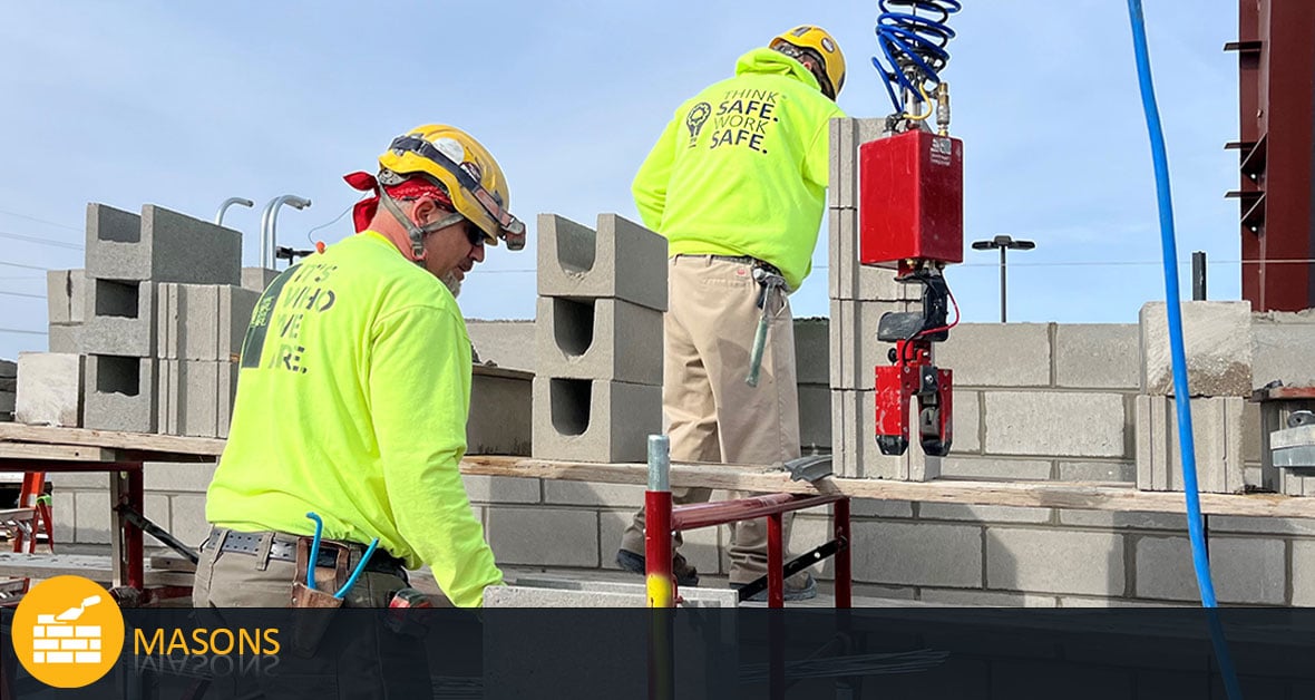 CD Smith masons working on concrete block wall on commercial construction jobsite in Fond du Lac Wisconsin