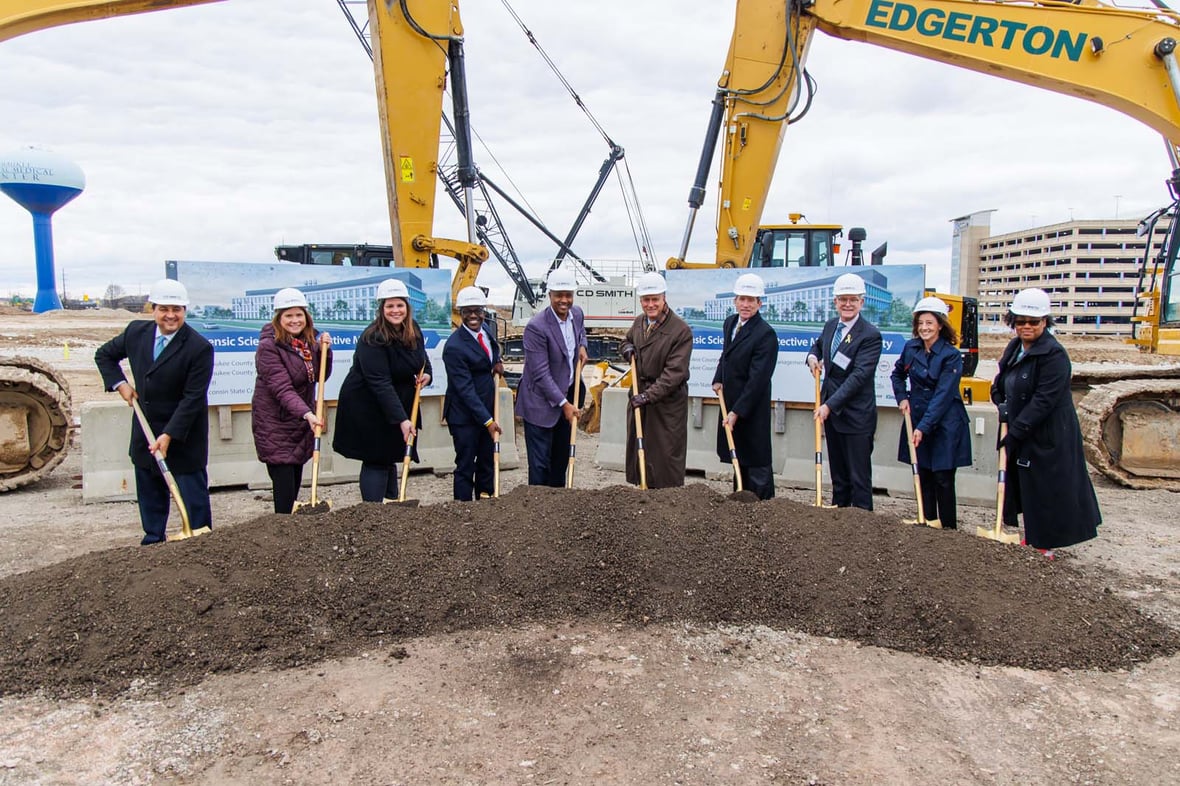 Stakeholders with shovels and dirt at groundbreaking ceremony for the Forensic Science and Protective Medicine Facility project construction with CD Smith