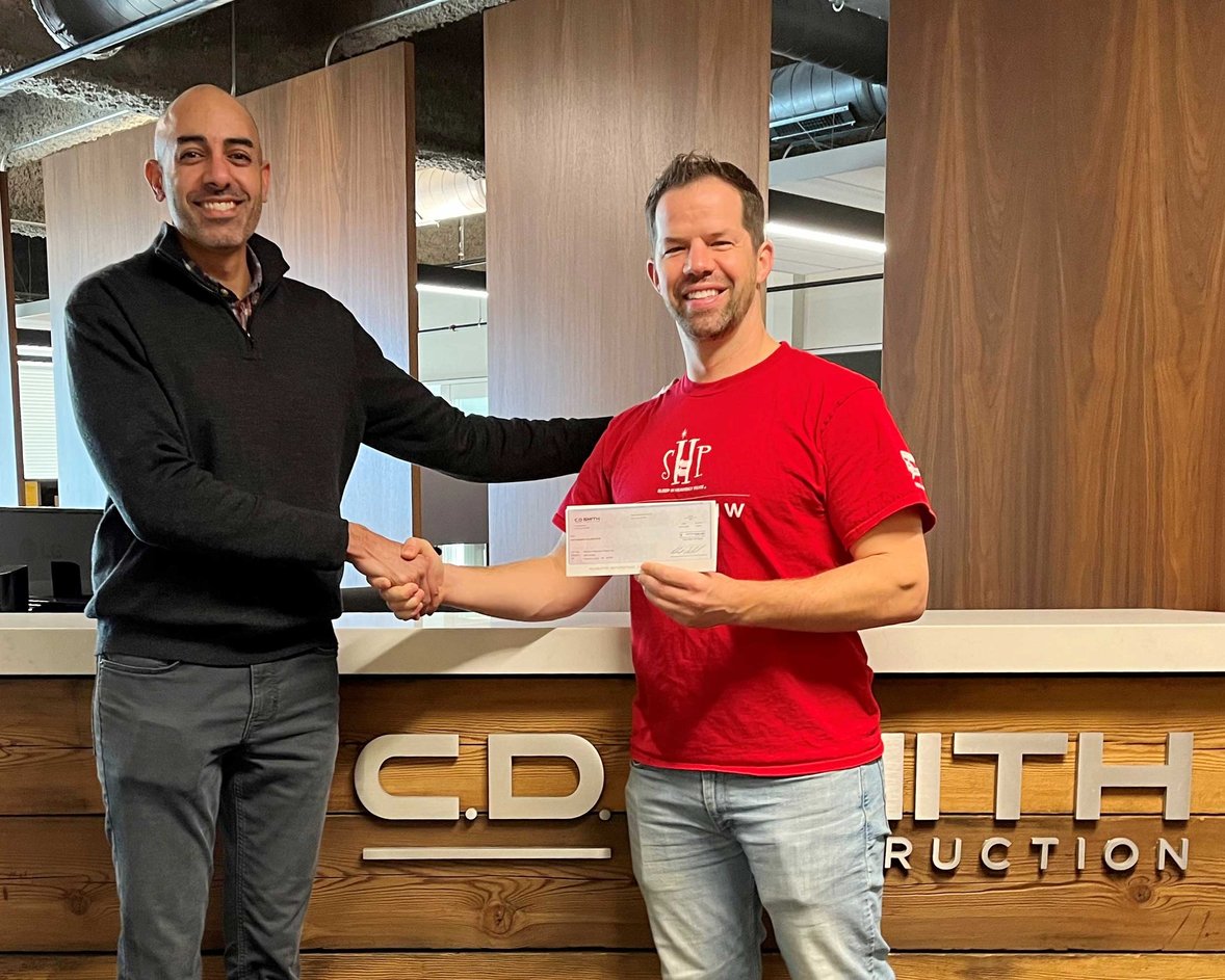 Nanak Malhotra (at left) pictured with SHP WI-Madison Chapter President Casey Klock at C.D. Smith Construction's Madison Office