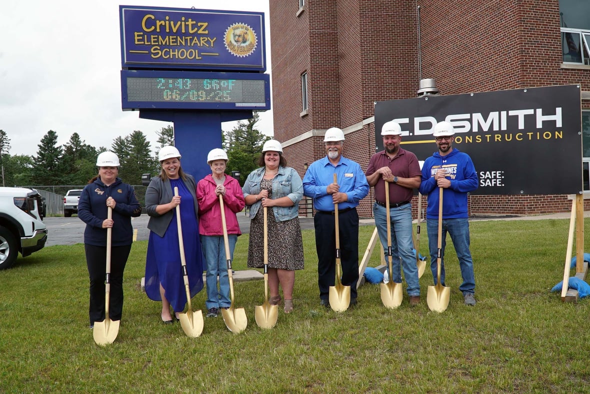 Crivitz Elementary School staff members holding shovels at the school construction groundbreaking ceremony