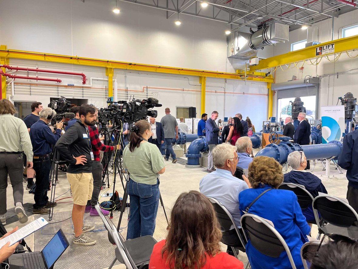 Crowds with Waukesha Mayor Shawn Reilly and Milwaukee Mayor Cavalier Johnson celebrate the Waukesha Water Utility construction project completion